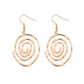 Boucles d'oreilles créatives tourbillonnantes et creuses pour femmes