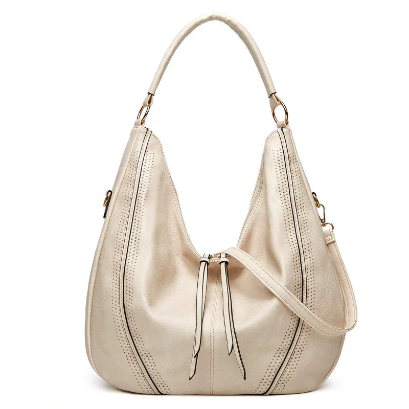 Sac à bandoulière fourre-tout tendance rétro grande capacité avec gland et motif ajouré pour femme