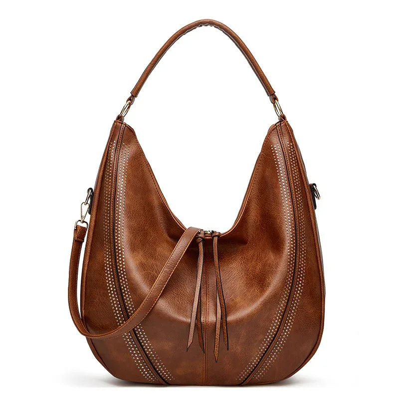 Sac à bandoulière fourre-tout tendance rétro grande capacité avec gland et motif ajouré pour femme