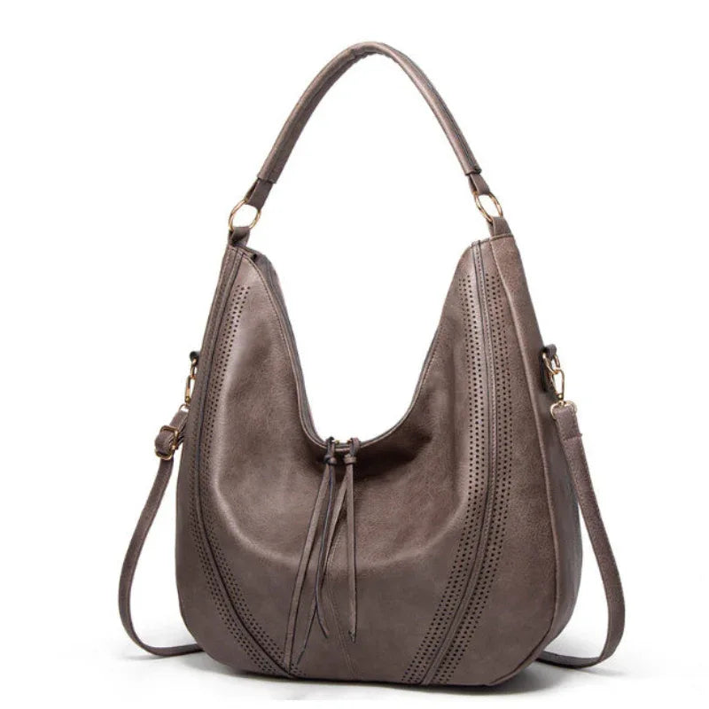 Sac à bandoulière fourre-tout tendance rétro grande capacité avec gland et motif ajouré pour femme