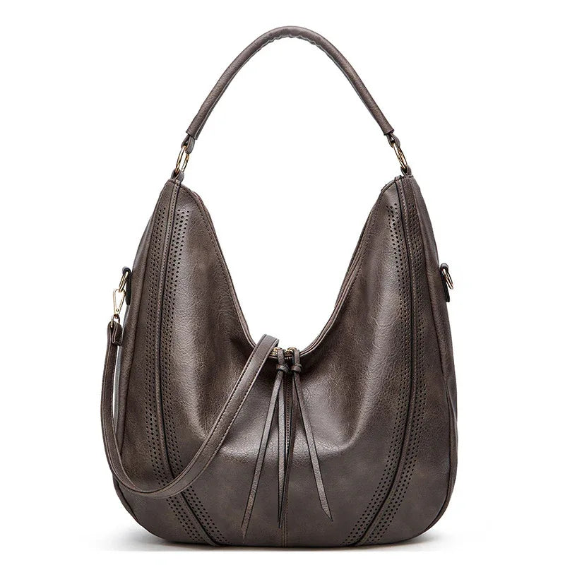 Sac à bandoulière fourre-tout tendance rétro grande capacité avec gland et motif ajouré pour femme